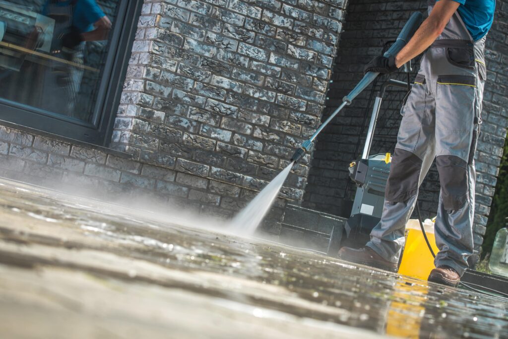 men-washing-driveway-min